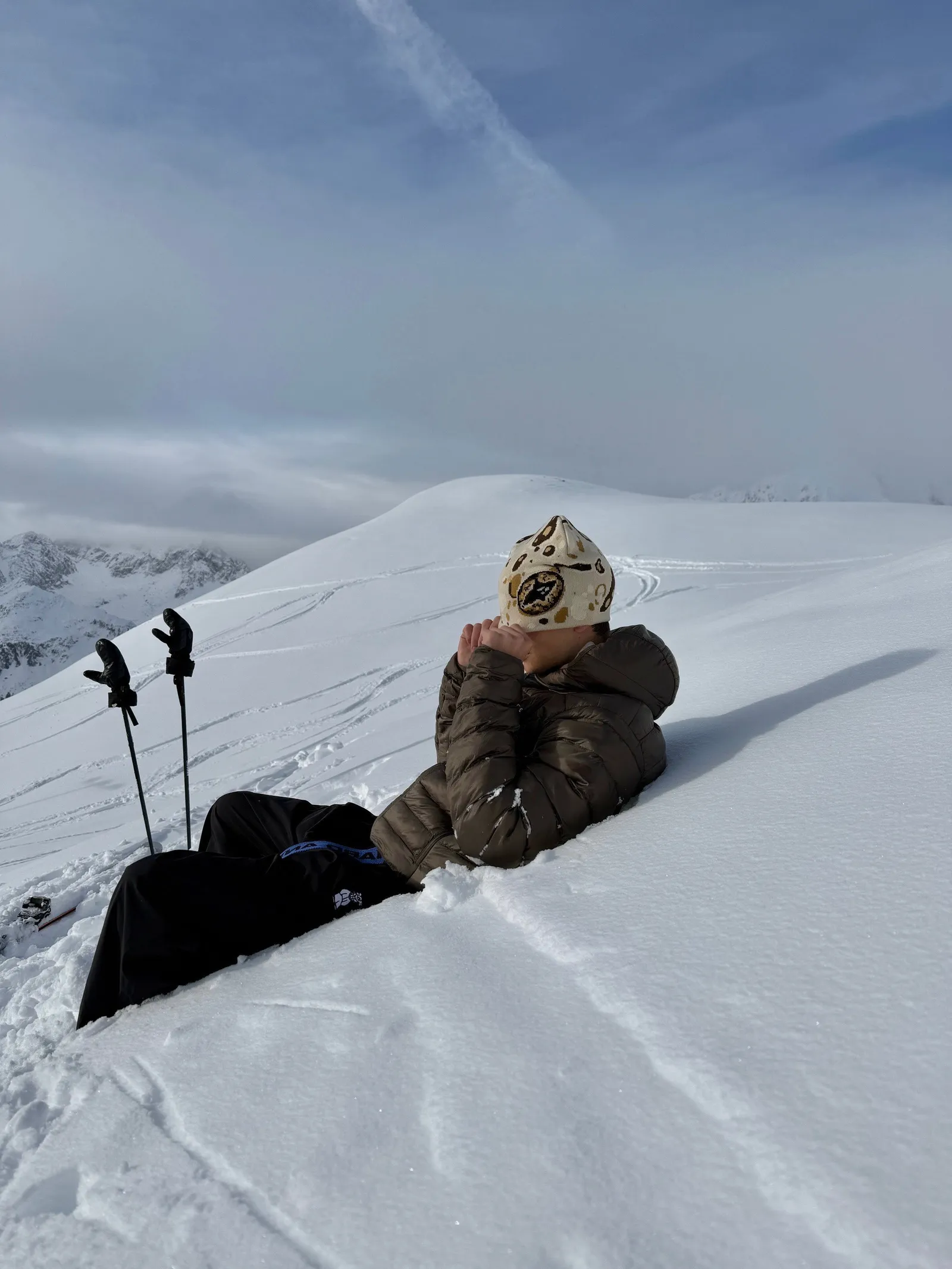 Wearer pictured high on an alpine slope in Two Frogs winter layers
